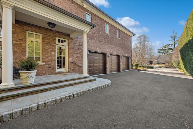 view of side of property featuring a garage