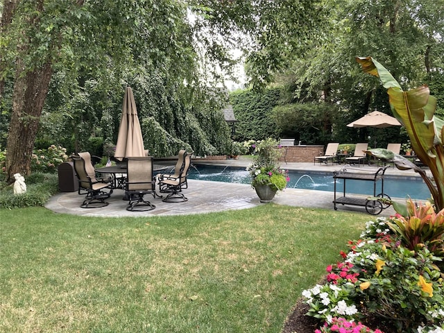 view of yard with pool water feature and a patio area