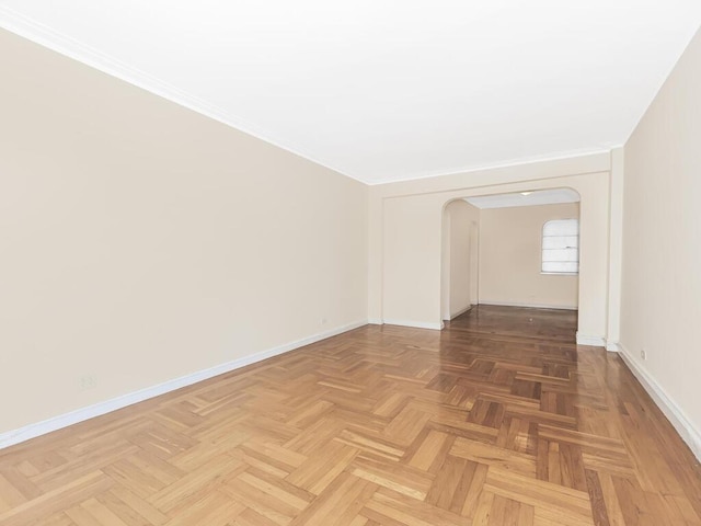 spare room featuring parquet flooring