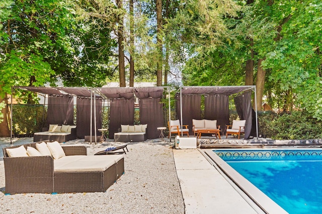 view of pool with a patio area and outdoor lounge area