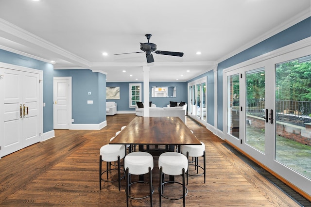 dining room featuring ornamental molding, plenty of natural light, dark hardwood / wood-style flooring, and french doors