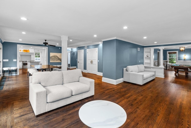 living room featuring crown molding, pool table, dark hardwood / wood-style floors, and decorative columns