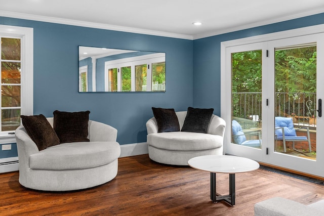 sitting room featuring hardwood / wood-style flooring, ornamental molding, and a wealth of natural light