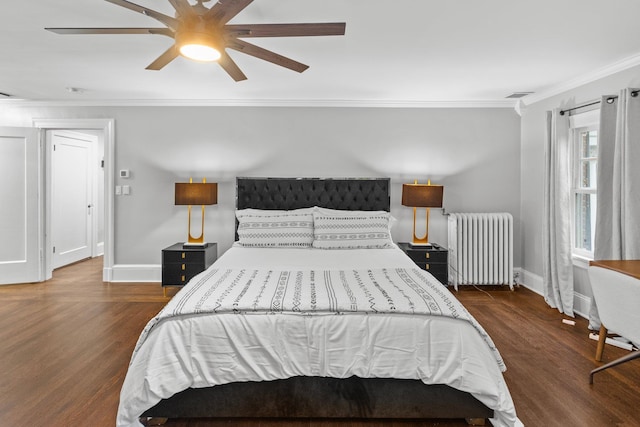 bedroom featuring crown molding, ceiling fan, dark hardwood / wood-style flooring, and radiator