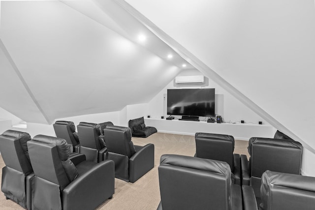 cinema room with vaulted ceiling, an AC wall unit, and light carpet