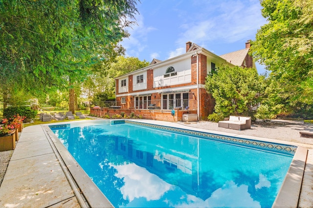 view of swimming pool with a patio area