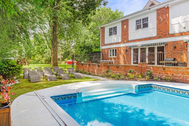 view of swimming pool with a patio