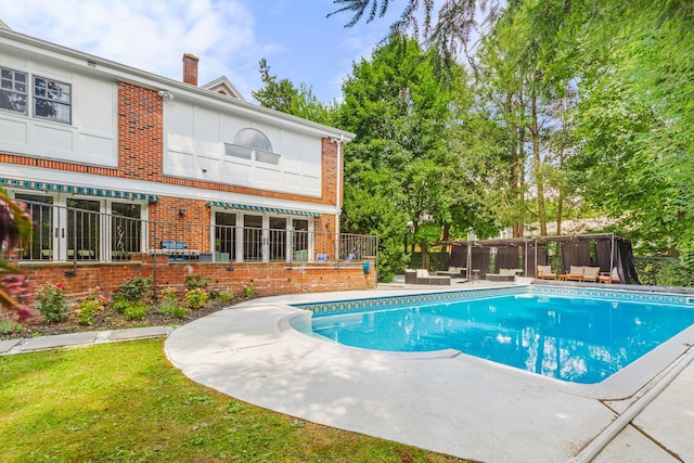 view of swimming pool with a patio