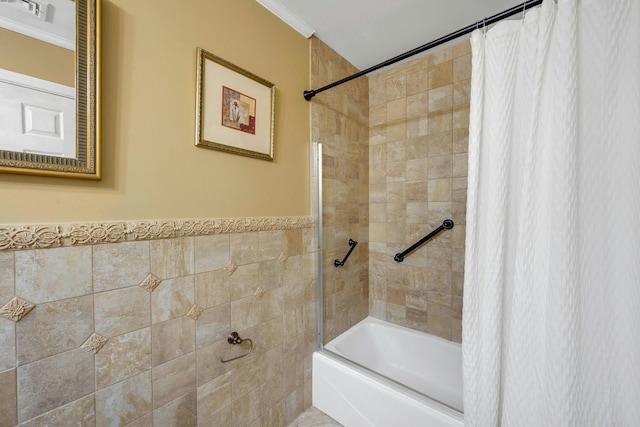 bathroom featuring tile walls and shower / tub combo