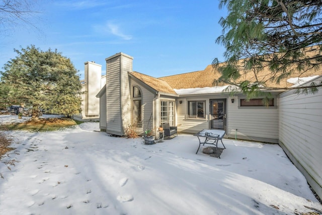 view of snow covered house