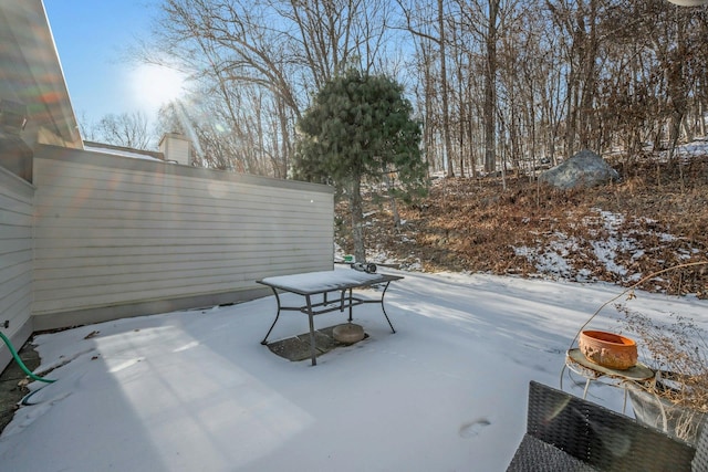 view of snow covered patio