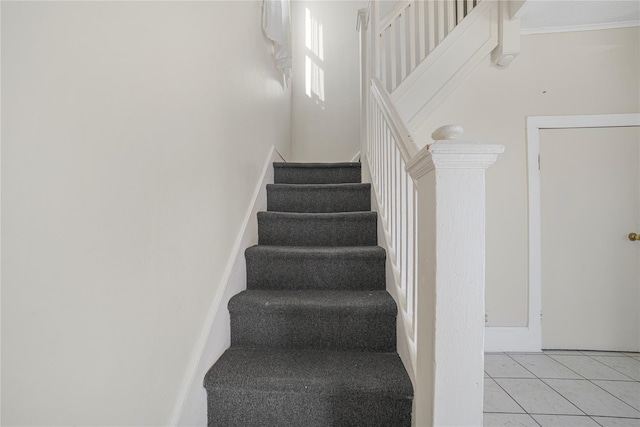 stairs with tile patterned floors