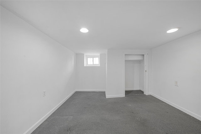 basement with dark colored carpet