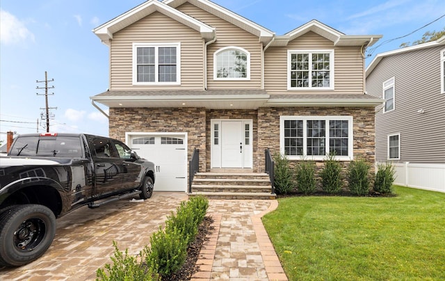 view of front of property with a garage and a front yard