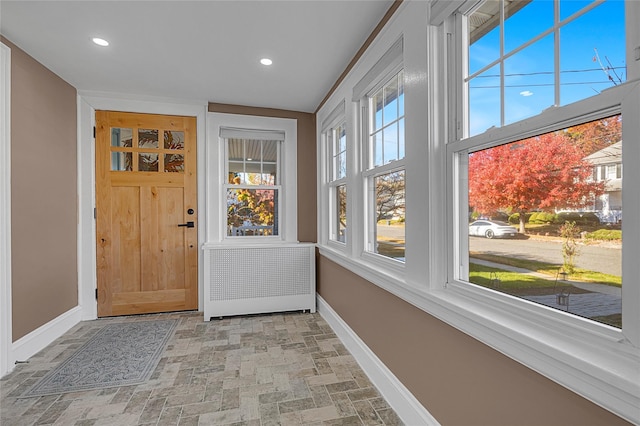 entryway featuring radiator