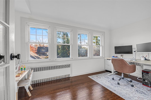 home office featuring dark wood-type flooring and radiator heating unit