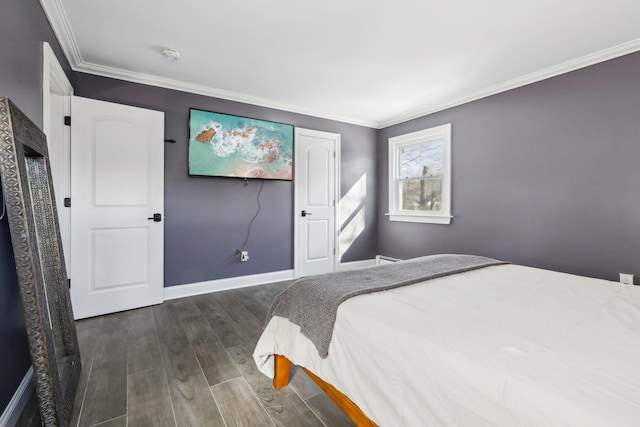 bedroom featuring dark wood-type flooring and ornamental molding