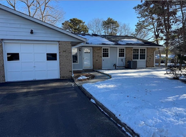 ranch-style house featuring central AC unit