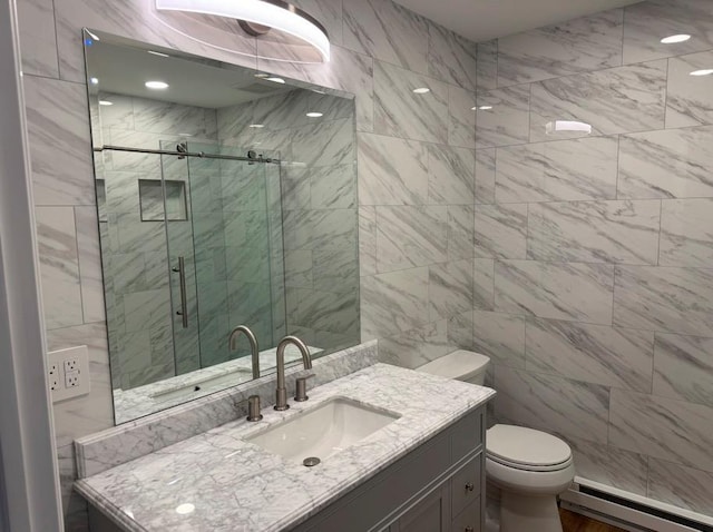 bathroom with toilet, vanity, an enclosed shower, and baseboard heating