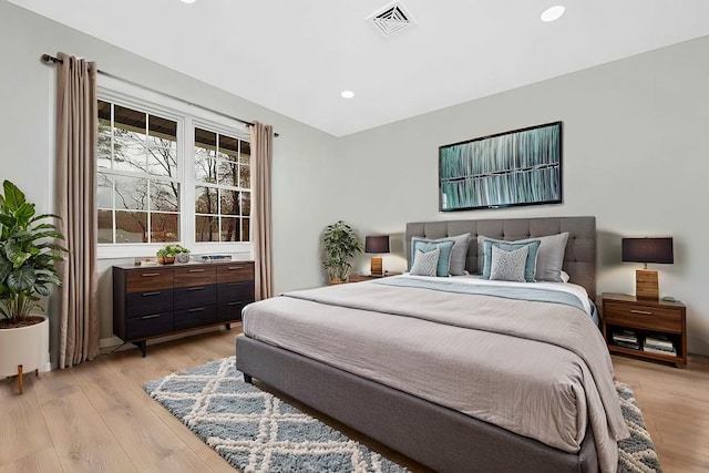 bedroom with light hardwood / wood-style flooring