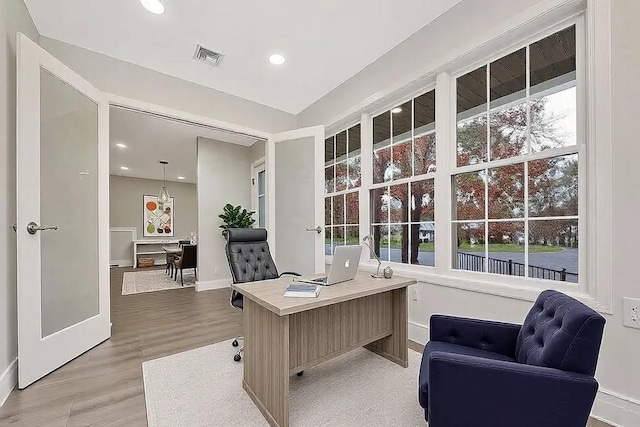 home office featuring hardwood / wood-style flooring