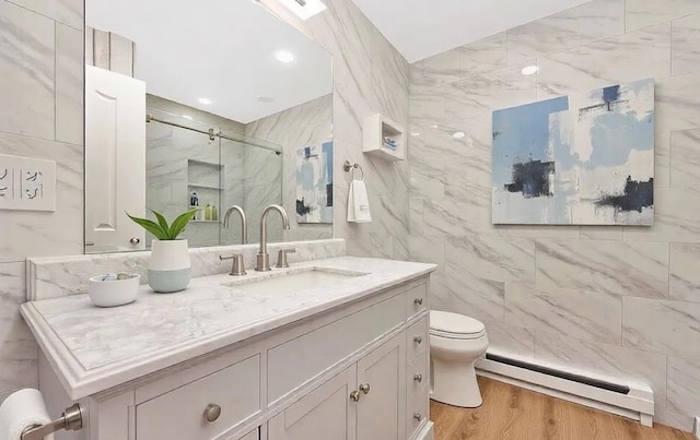 bathroom with hardwood / wood-style floors, tile walls, walk in shower, toilet, and a baseboard radiator