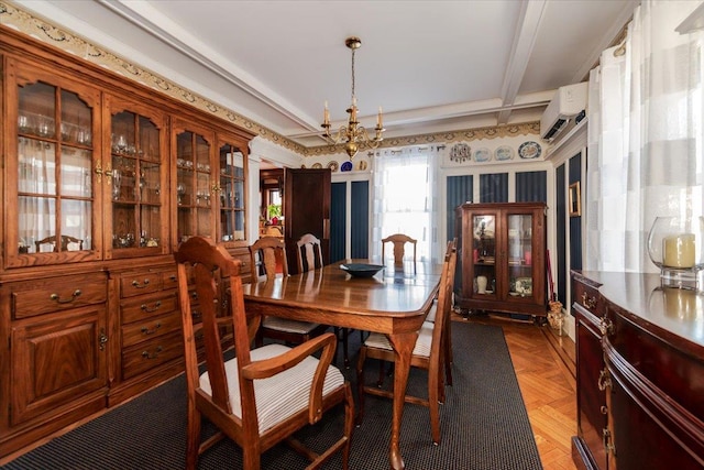 dining space featuring beam ceiling, parquet flooring, a chandelier, and a wall mounted AC