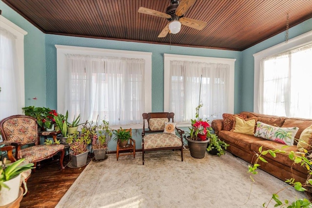 sunroom / solarium featuring ceiling fan