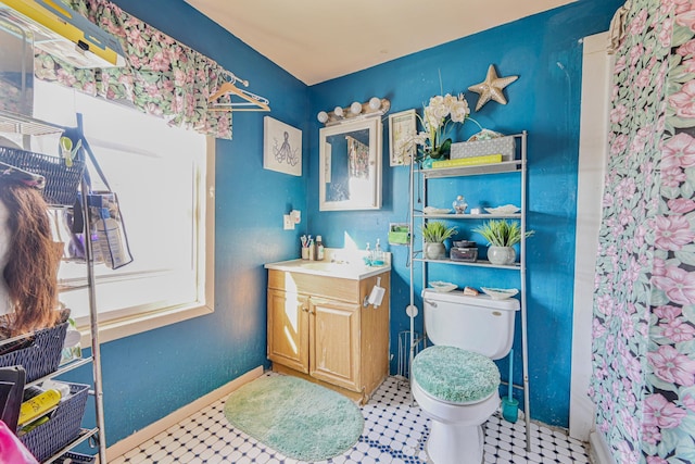 bathroom with vanity and toilet