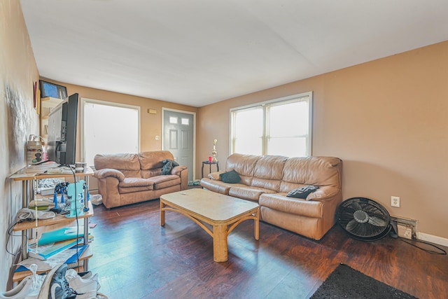 living room featuring dark wood-type flooring