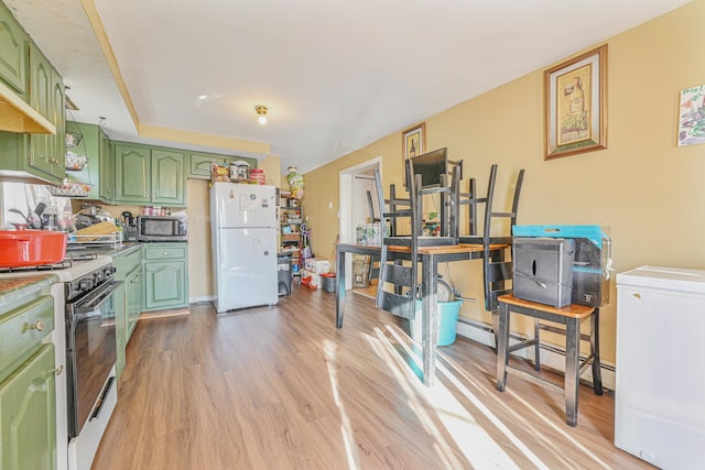 kitchen with white appliances, light hardwood / wood-style floors, and green cabinets