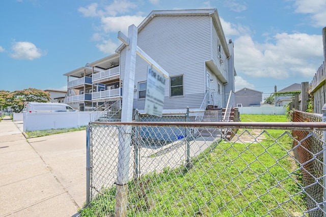 20 E Pine St, Long Beach, NY 11561 - view of home's exterior with a fenced backyard