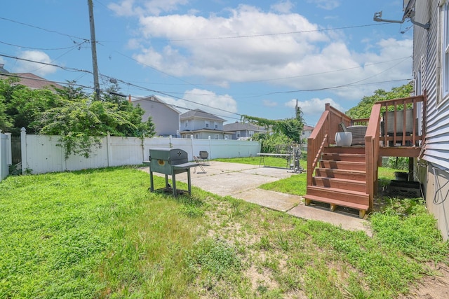 20 E Pine St, Long Beach, NY 11561 - fenced backyard with a patio and a deck