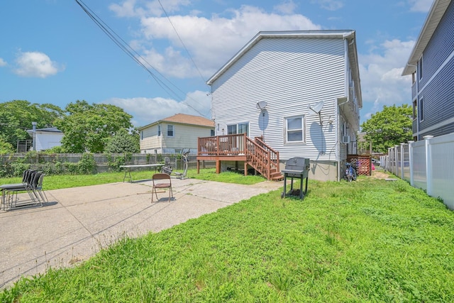 20 E Pine St, Long Beach, NY 11561 - rear view of house featuring a deck, a fenced backyard, and a patio