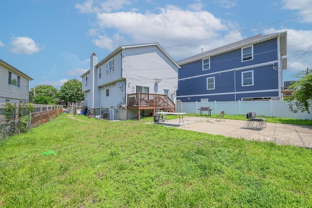 20 E Pine St, Long Beach, NY 11561 - rear view of house featuring a patio, a wooden deck, and a chimney