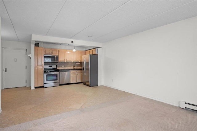 kitchen with appliances with stainless steel finishes, light carpet, decorative backsplash, and decorative light fixtures