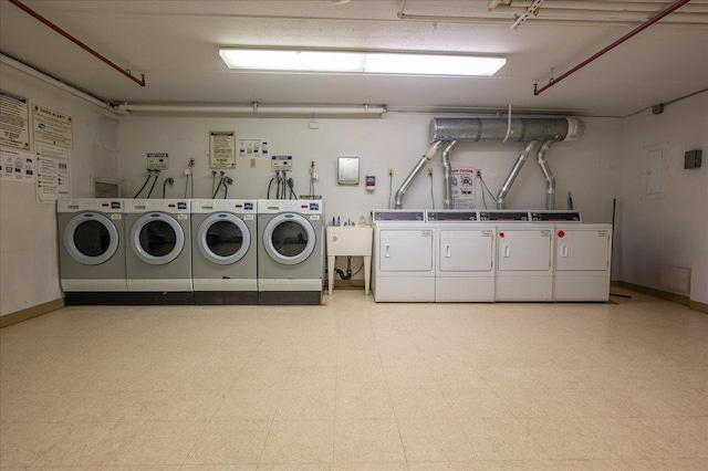 laundry area with sink and independent washer and dryer