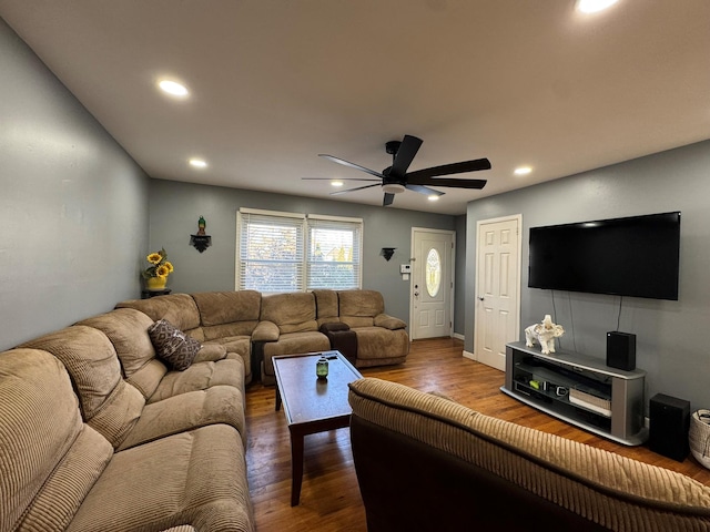 living room with hardwood / wood-style floors and ceiling fan