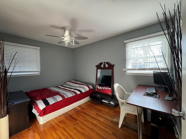 bedroom featuring wood-type flooring and ceiling fan