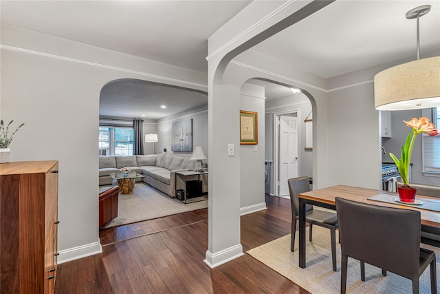 dining room with dark wood-type flooring