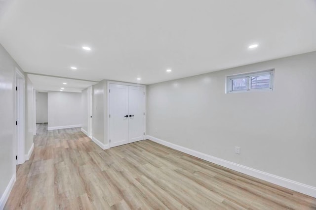 basement featuring light hardwood / wood-style floors