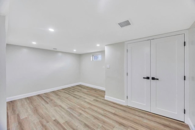 basement featuring light wood-type flooring