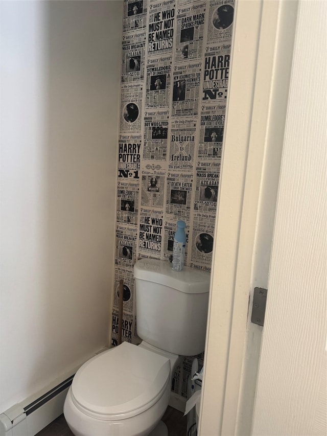 bathroom with toilet and baseboard heating