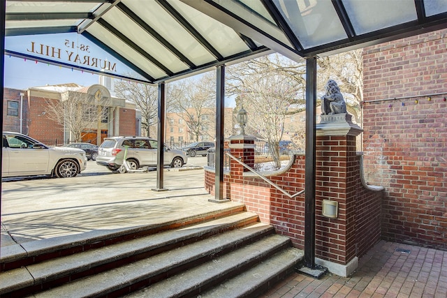 exterior space featuring lofted ceiling