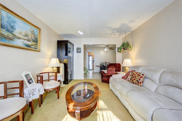 carpeted living room featuring ceiling fan