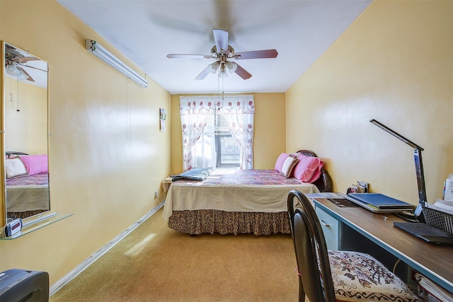 bedroom featuring ceiling fan and carpet