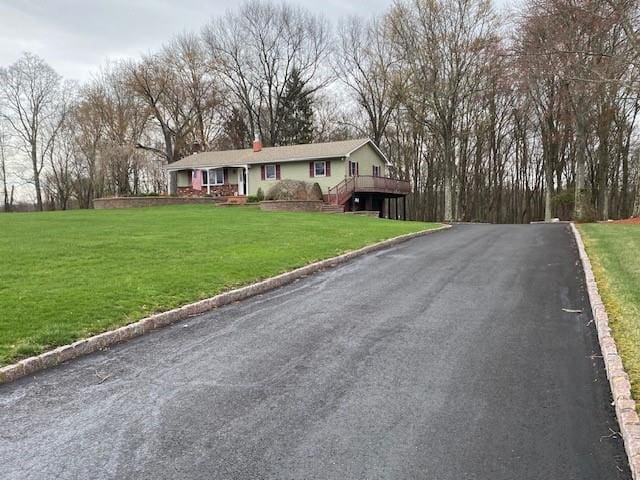 176 Gardnerville Rd, New Hampton, NY 10958 - view of front facade with a chimney, driveway, and a front yard