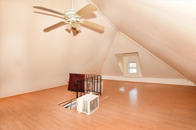 additional living space with lofted ceiling and hardwood / wood-style floors