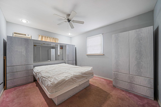 bedroom featuring carpet floors, a wall mounted air conditioner, and ceiling fan