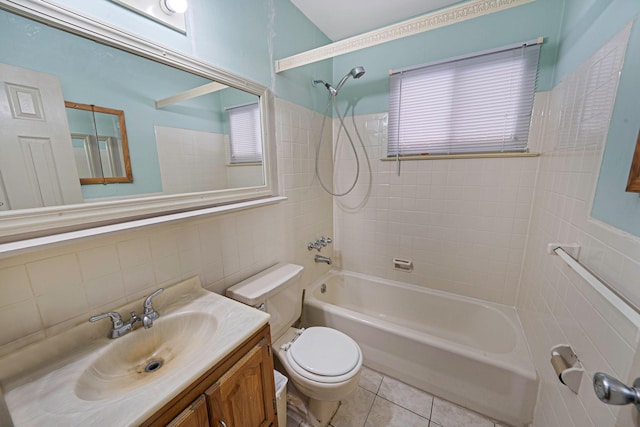 full bathroom with toilet, tiled shower / bath, vanity, tile patterned flooring, and backsplash